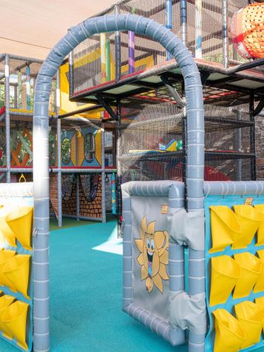 a playground with a climbing frame and a play structure at Nana Golden Beach All Inclusive Resort & Spa in Hersonissos