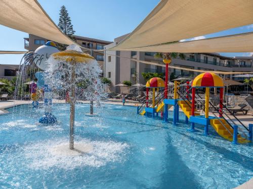 a pool with a water park with a water slide at Nana Golden Beach All Inclusive Resort & Spa in Hersonissos