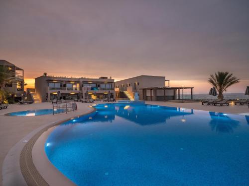 a large swimming pool in front of a resort at Nana Golden Beach All Inclusive Resort & Spa in Hersonissos