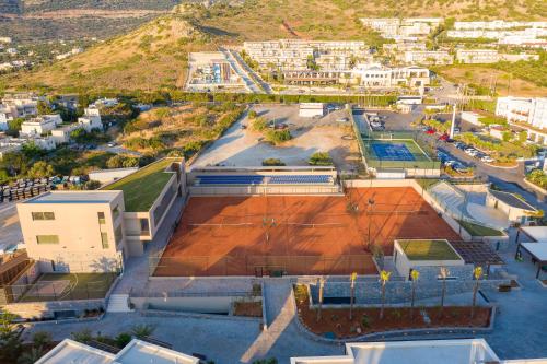 an overhead view of a tennis court in a city at Nana Golden Beach All Inclusive Resort & Spa in Hersonissos