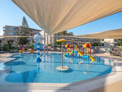 a large swimming pool with a water park at Nana Golden Beach All Inclusive Resort & Spa in Hersonissos