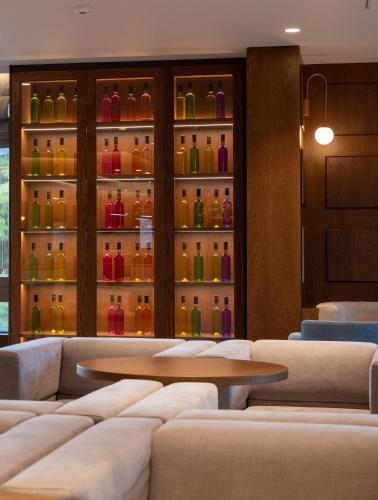 a restaurant with a lot of bottles on the wall at Nana Golden Beach All Inclusive Resort & Spa in Hersonissos