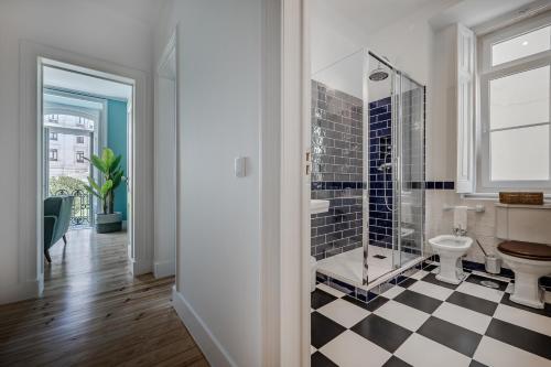a bathroom with a shower and a toilet at Casas de São Bento in Lisbon