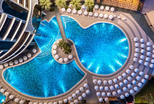 an overhead view of a large swimming pool in a building at Leodikya Kirman Premium - Ultra All Inclusive in Okurcalar