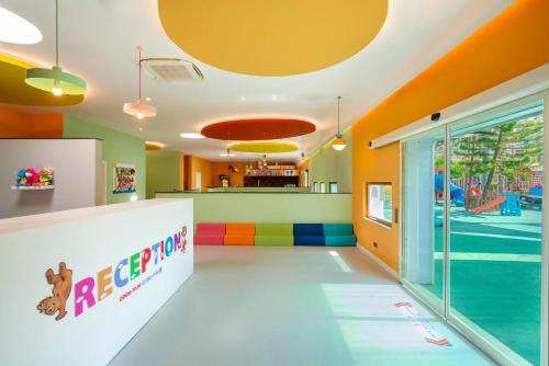 a childrens play room with a pool and a playground at Leodikya Kirman Premium - Ultra All Inclusive in Okurcalar