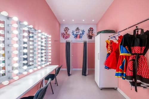 a dressing room with pink walls and chairs at Leodikya Kirman Premium - Ultra All Inclusive in Okurcalar