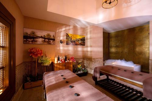 a room with a bench and a table in it at Leodikya Kirman Premium - Ultra All Inclusive in Okurcalar