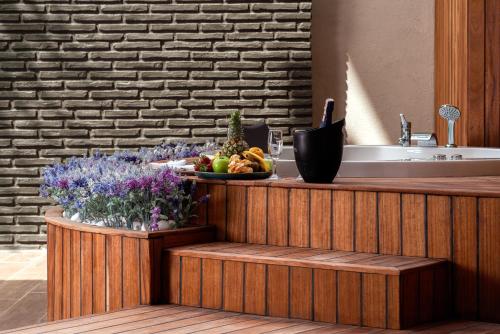 a counter with a bowl of fruit and a sink at Leodikya Kirman Premium - Ultra All Inclusive in Okurcalar