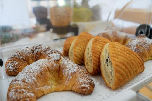 a bunch of croissants and other pastries on a tray at Tenuta San Lorenzo in Otranto