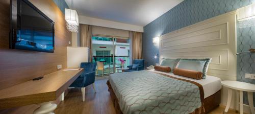 Ένα ή περισσότερα κρεβάτια σε δωμάτιο στο Sentido Trendy Verbena Beach Hotel