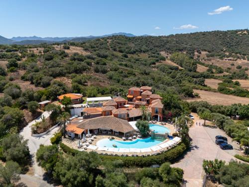 an aerial view of a resort with a swimming pool at Felix Hotels - Galanias Hotel & Retreat in Bari Sardo