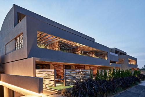 a modern house with a lot of windows at NEMA Design Hotel & Spa - Adults Only in Hersonissos