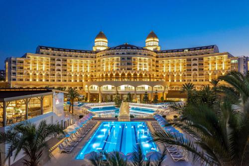 a hotel with a pool in front of a building at Sidemarin Kirman Premium - Ultra All Inclusive in Side