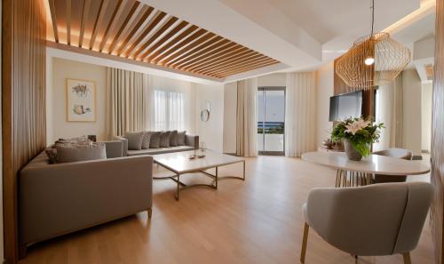 a living room with a couch and a table at Miramare Beach Hotel - Ultra All Inclusive in Side