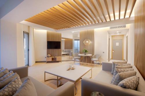 a living room with a couch and a table at Miramare Beach Hotel - Ultra All Inclusive in Side