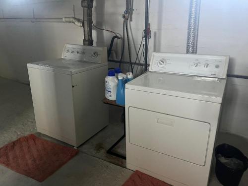 a washing machine and a washer in a room at A-Frame Charmer in Town, Newly Renovated in LaPorte