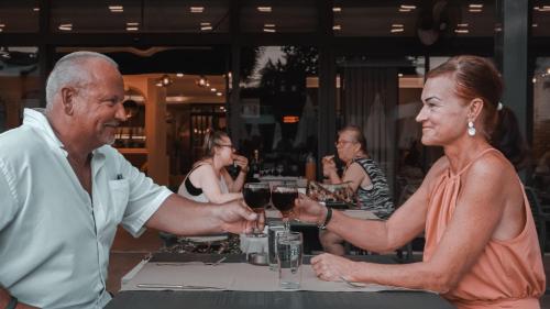 a man and a woman holding glasses of wine at Side Zeugma Hotel - Adult Only 16 Plus in Side