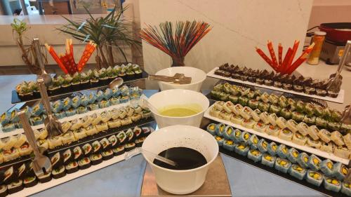 a buffet of sushi and other food on display at Side Zeugma Hotel - Adult Only 16 Plus in Side