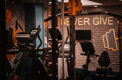 a gym with a sign that reads never give at Side Zeugma Hotel - Adult Only 16 Plus in Side