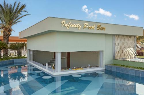 a rendering of a luxury mall with a swimming pool at Kirman Belazur Resort & Spa in Belek