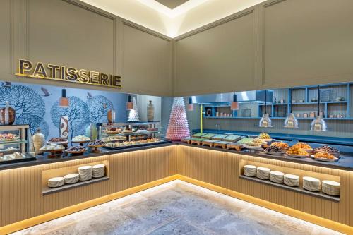 a bakery with a lot of pastries on display at Kirman Belazur Resort & Spa in Belek