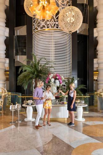a group of people standing in a lobby at Kirman Belazur Resort & Spa in Belek