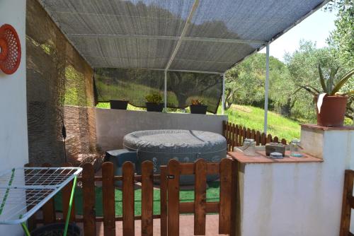 a patio with a tire under a cover at Villino Anna e Pippino in Calatafimi
