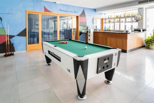a pool table in the middle of a room at Hotel Amic Horizonte in Palma de Mallorca