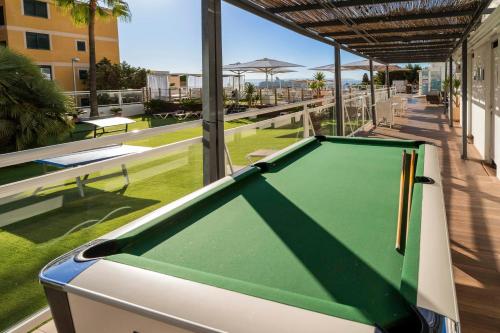 a pool table on the balcony of a building at Hotel Amic Horizonte in Palma de Mallorca