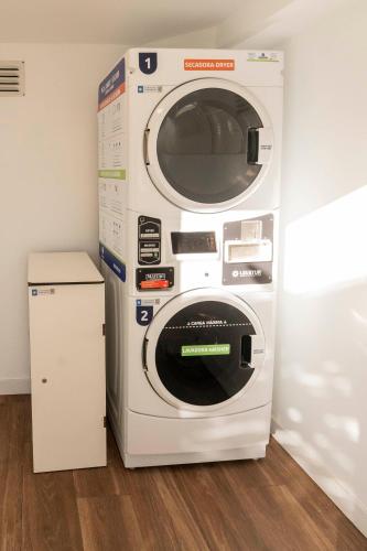 a washer and dryer stacked on top of each other at Hotel Amic Horizonte in Palma de Mallorca