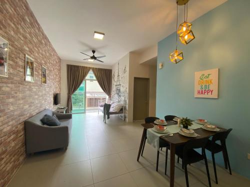 a living room with a table and a couch at Cameron Golden Hills Near Night Market CH1 in Brinchang