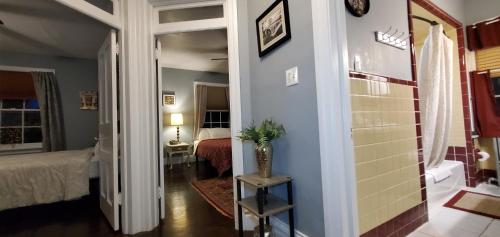 a hallway leading to a room with a bedroom at Simmons Motel and Suites in Hershey