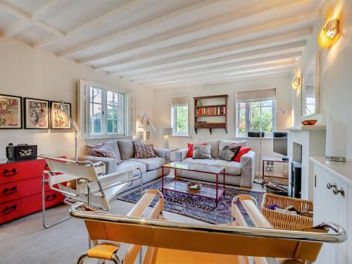 a living room with a couch and a table at Pensway in Burpham