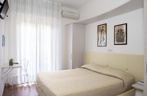 Postel nebo postele na pokoji v ubytování Hotel Anfora