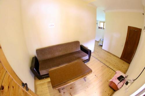 an empty bench in the corner of a room at Guest House Keti Margiani Mestia in Mestia