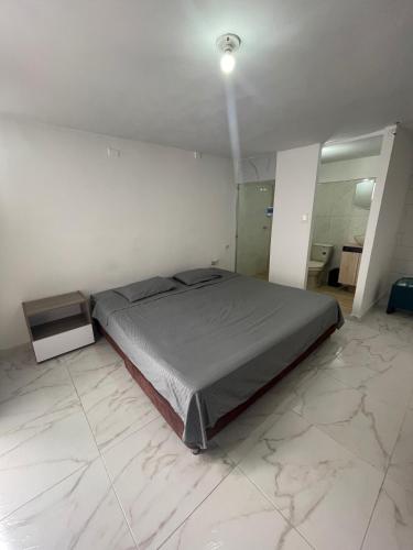 Postel nebo postele na pokoji v ubytování Hostel Titan Plaza Cll 80