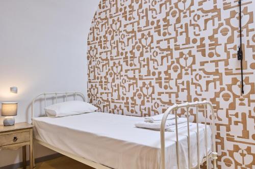 Pappoudiko Myrto's Residenceにあるベッド