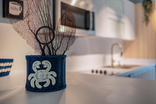 a blue vase sitting on top of a kitchen counter at Dorado Del Mar Villa by PH in Dorado