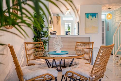 a dining room with a table and chairs at Dorado Del Mar Villa by PH in Dorado