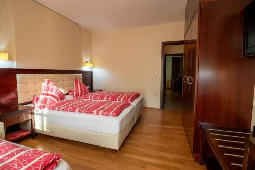 Ένα ή περισσότερα κρεβάτια σε δωμάτιο στο Vila Silva Marija Apartments