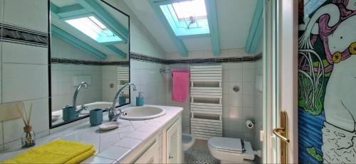 a bathroom with a sink and a toilet at Terrazza sul Mare in Lido di Camaiore
