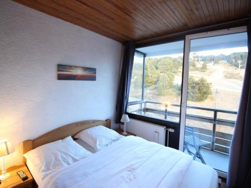 Postel nebo postele na pokoji v ubytování Appartement 2 pièces + cabine au pied des pistes à Chamrousse - FR-1-549-82