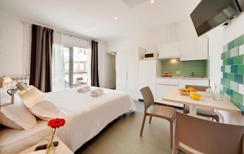 Ένα ή περισσότερα κρεβάτια σε δωμάτιο στο Residence Dei Viali