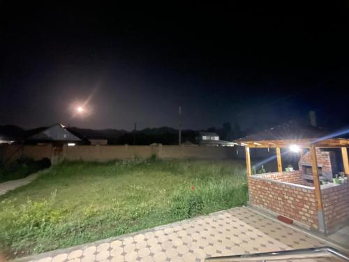 a yard at night with a gazebo at Mountain View in Kochkor