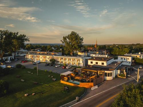 an aerial view of a town with a building at Auberge le Parasol in Saguenay