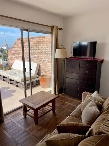 Televisyen dan/atau pusat hiburan di Penthouse Duplex en Pocitos
