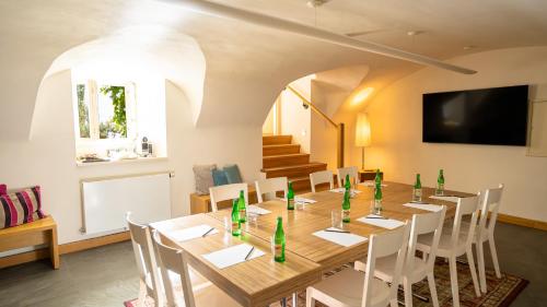 a dining room with a long table and chairs at Hotel Golden Key Prague Castle in Prague