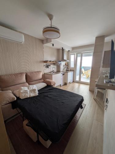 Ένα ή περισσότερα κρεβάτια σε δωμάτιο στο Estudio Playa Barbate