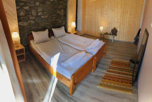 a bedroom with a large bed in a room at Guest House Keti Margiani Mestia in Mestia