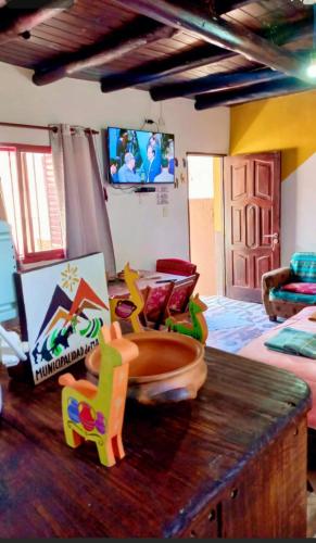 a room with a table with a toy bowl on it at Cabañas virgen de la candelaria in Maimará
